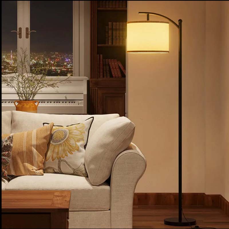 Elegant Line Floor Lamp in a modern living room with sofa and cityscape view.
