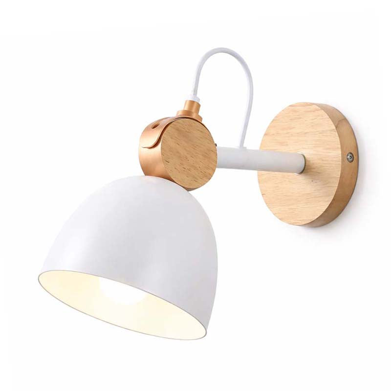 Wall-mounted lamp with white shade and gold metal accents on a white background