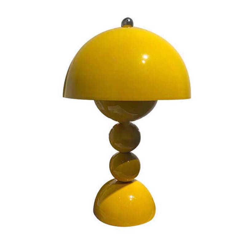 Yellow table lamp with a unique design on a white background