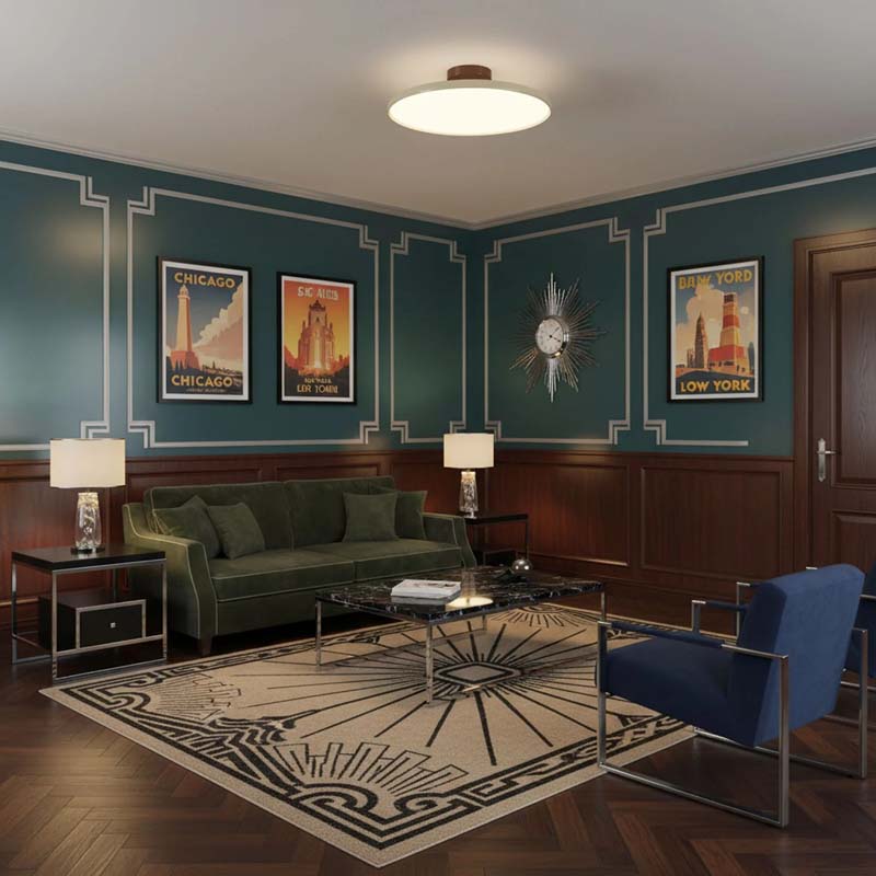 Adjustable Ceiling Light Pivot in Living Room with Green Sofa, Blue Armchair and Decorative Wall Art.