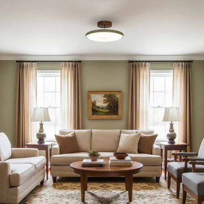 Adjustable Ceiling Light Pivot in Living room with beige sofa, armchair and coffee table in home setting.