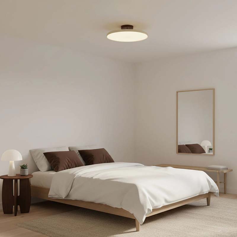Adjustable Ceiling Light Pivot in a modern bedroom with a bed, nightstand and mirror.