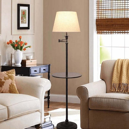 Living room with a swing-arm floor lamp, beige sofa, and decorative items.