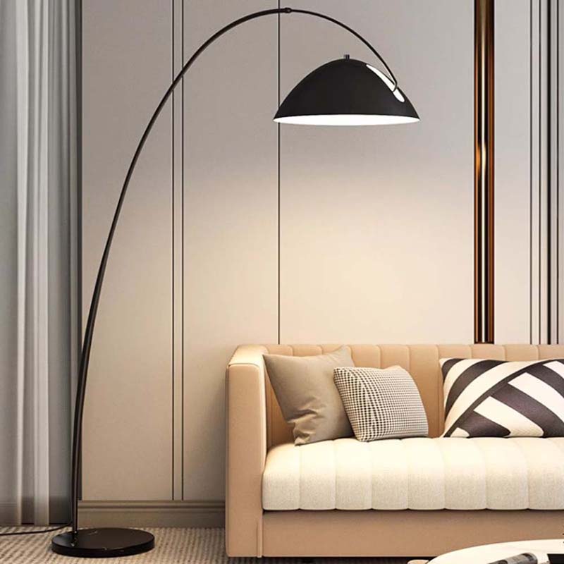 Arc floor lamp “Bowl” over a sofa in a modern interior