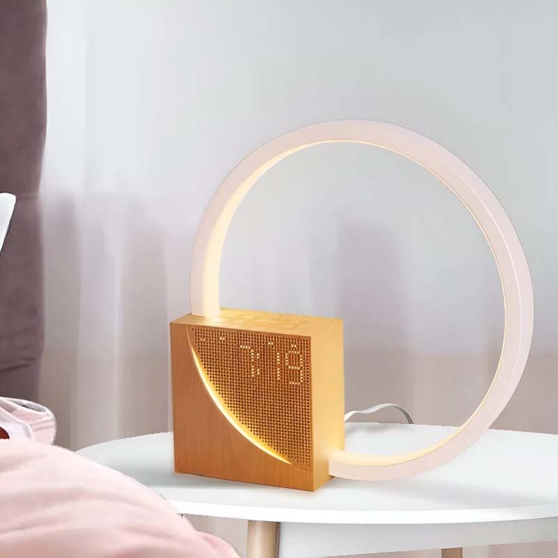 Sunrise alarm clock with warm ambient night light on bedside table