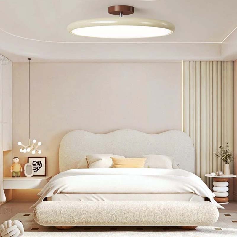 Adjustable Ceiling Light Pivot in bedroom with bed and decor elements.