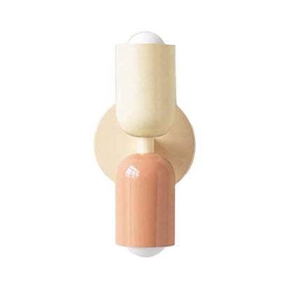 Wall-mounted light fixture with beige and peach-colored design on a white background