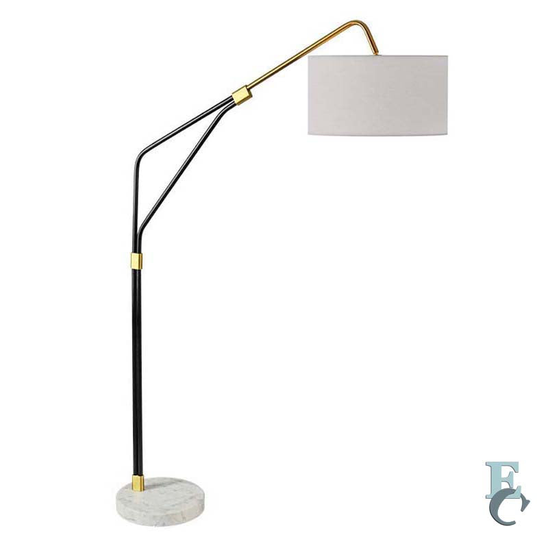 Floor lamp with black and gold arm and white shade on a white background