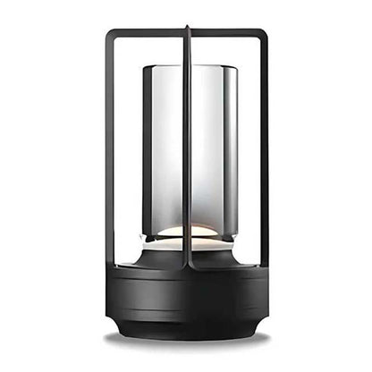 Black cylindrical lamp with glass cover on a white background