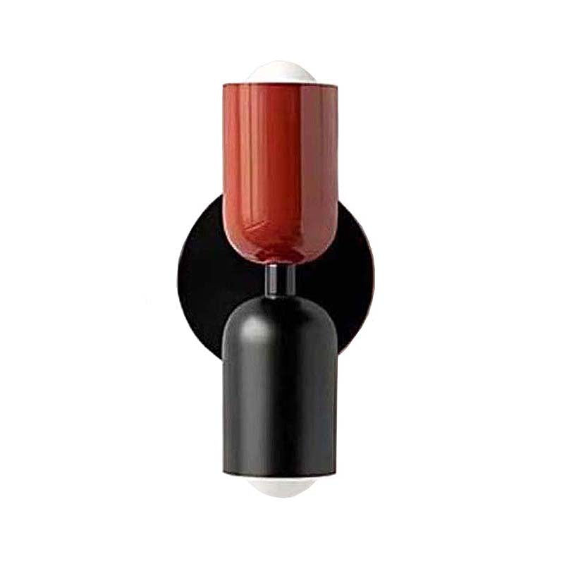 Wall-mounted lamp with a red glass shade and black base on a white background