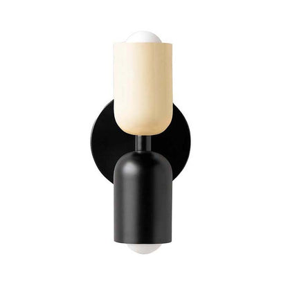 Wall-mounted lamp with black base and beige shade on a white background