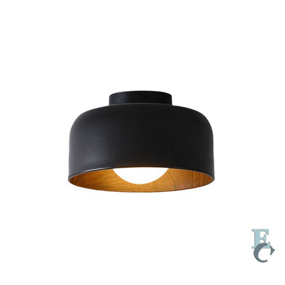 Black ceiling light fixture with wooden inner shade on a white background