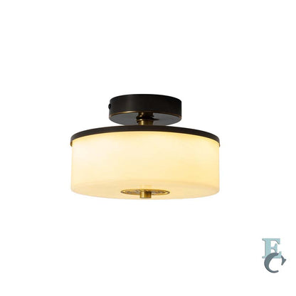 Ceiling light fixture with black and gold design on a white background