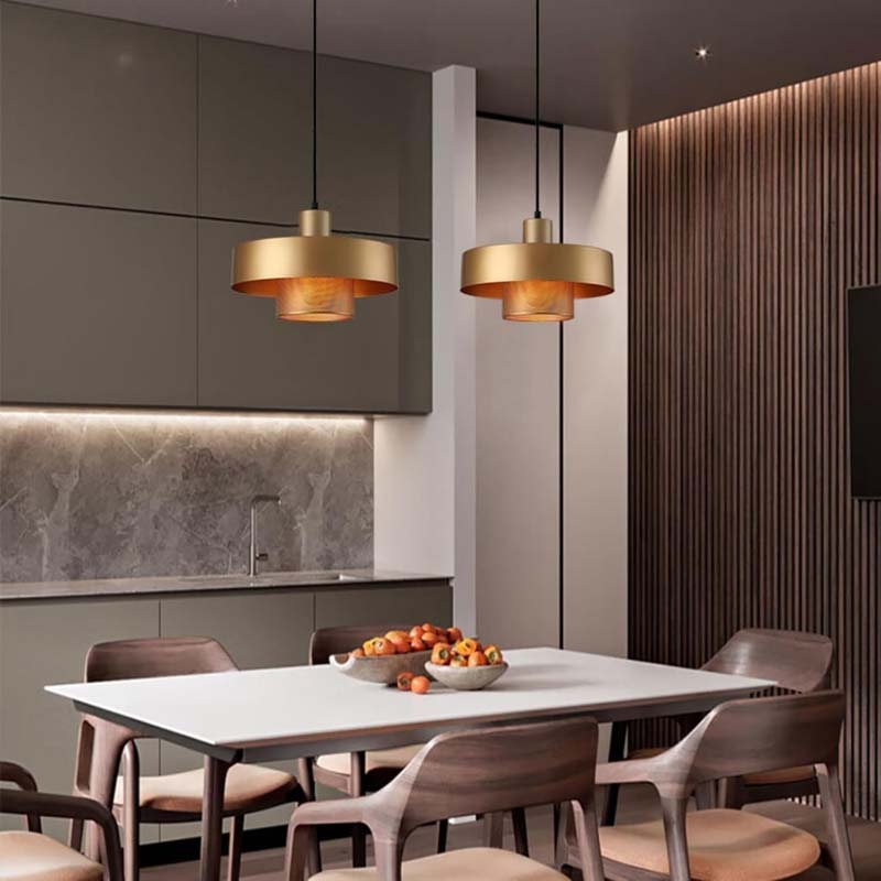 Black & Gold Pendant Light over the dining table in a modern kitchen.