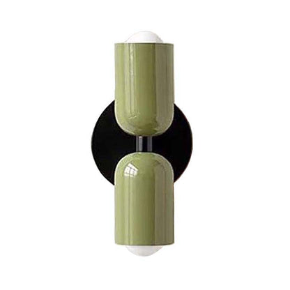 Decorative wall sconce with green and black design on a white background