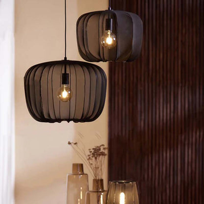 Two hanging pendant lights with ribbed design in a room setting.