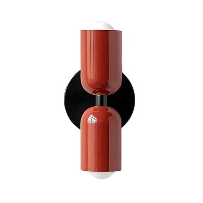 Modern wall sconce with red and black design on a white background