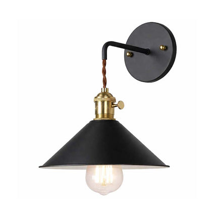 Black wall-mounted lamp with brass fixture on a white background