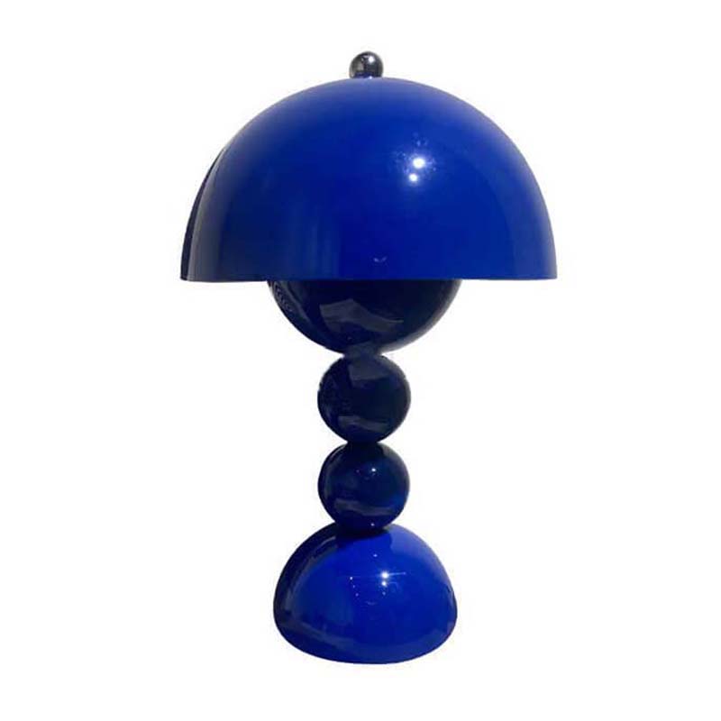 Blue table lamp with a unique design on a white background