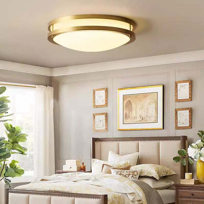 Modern bedroom with a ceiling light fixture, bed, and wall art.