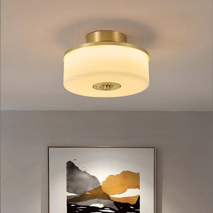 Ceiling light fixture in a room with a painting on the wall