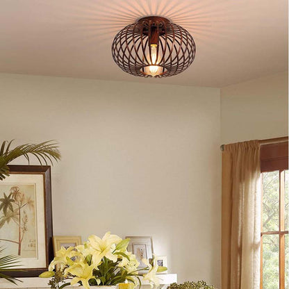 Ceiling light with a metal cage shade in a bright room.