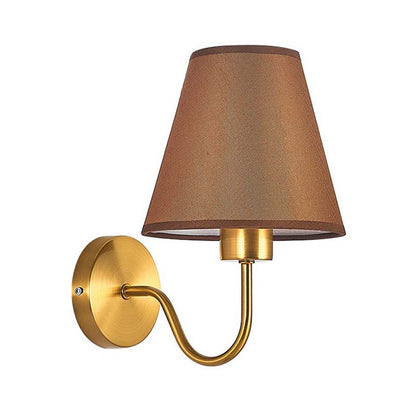 Wall-mounted lamp with brown shade and gold arm on a white background