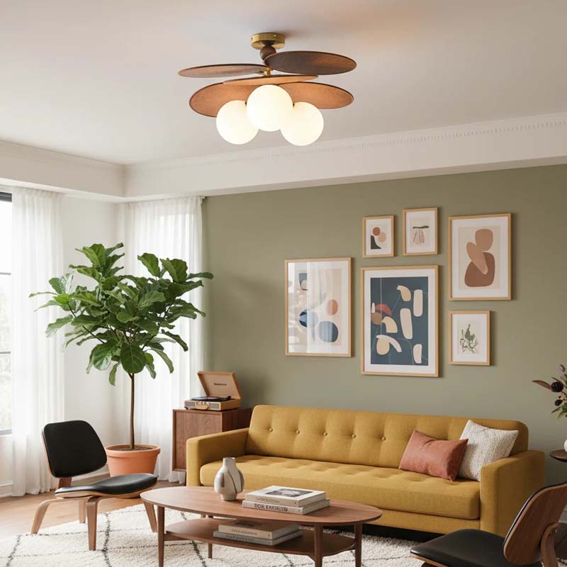 Cozy living room with a sofa, wall art, and a designer ceiling light.