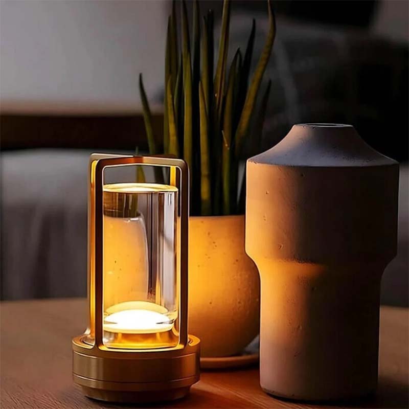 Decorative lamp with a plant and vase on a table