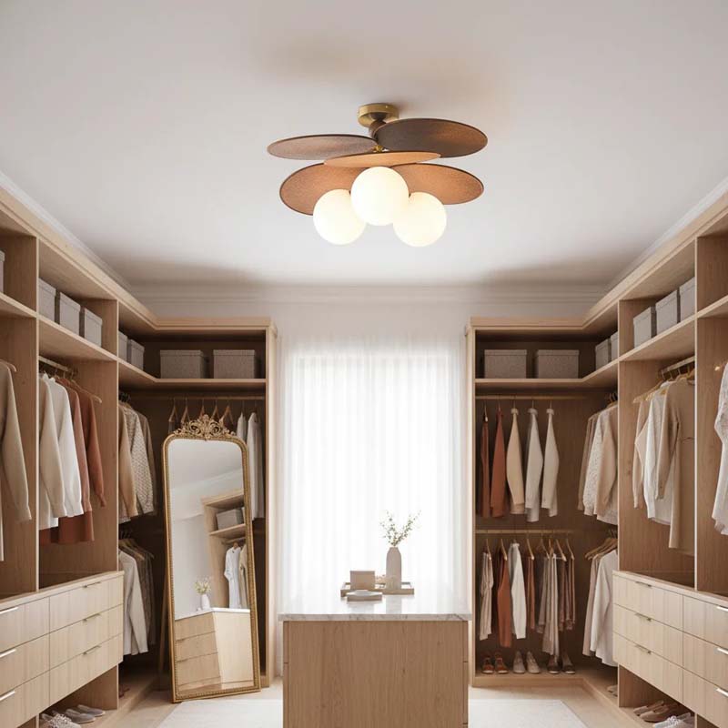 Designer ceiling light in a walk-in closet with wooden cabinetry