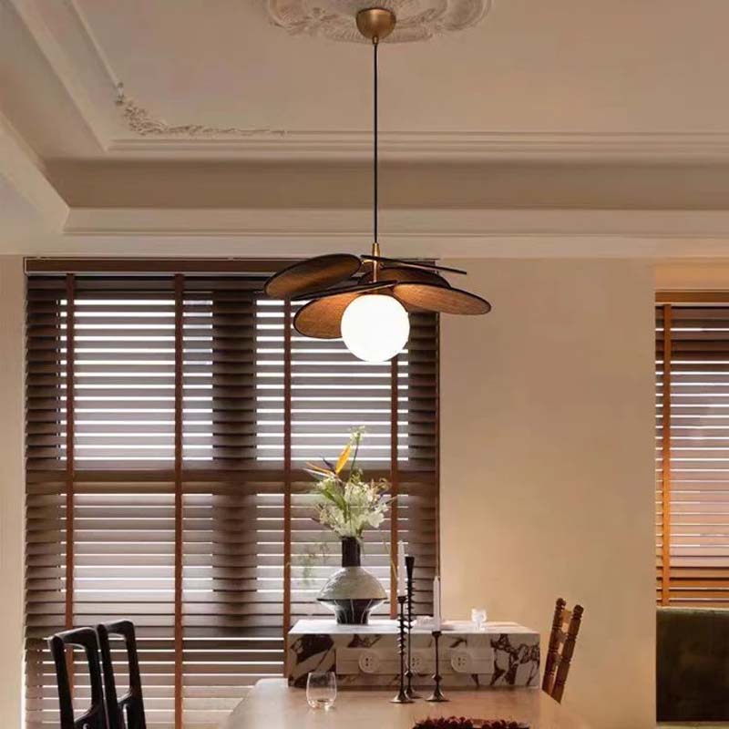 Designer pendant lamp hanging above a dining table