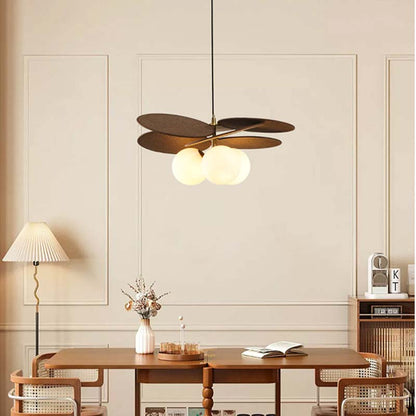 Designer pendant light with wooden elements and soft warm lighting.