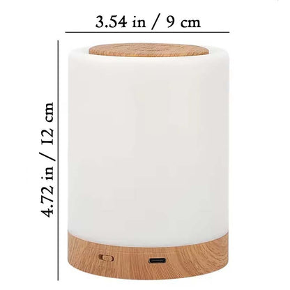 White cylindrical Portable Touch Control LED Bedside Night Light with a wooden top and bottom. Dimensions are listed.