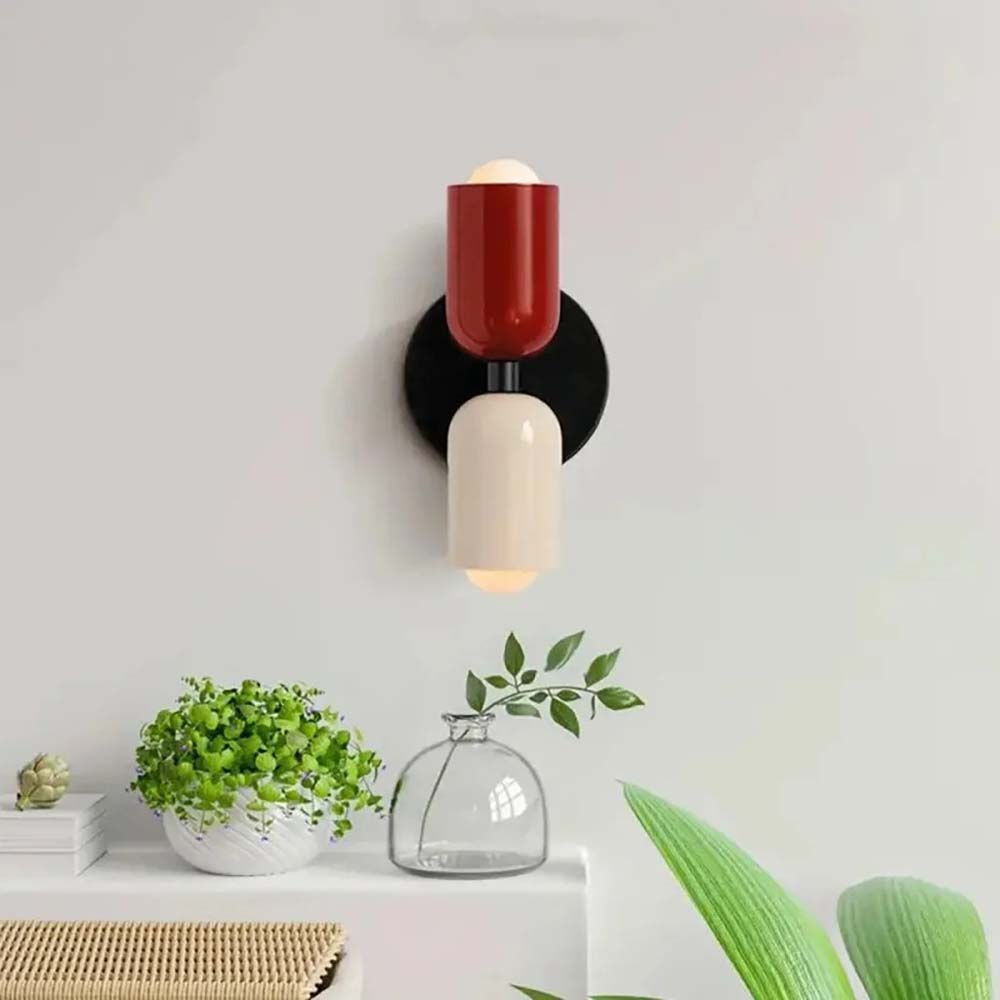 Modern wall lamp with red and white design on a light gray background