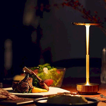 Table lamp on a dining table with a meal in the background