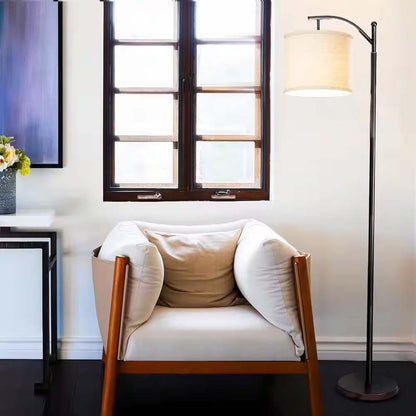 Elegant Line Floor Lamp in a modern living room with armchair, lamp and window.