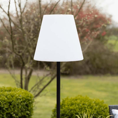 Enlarged white lampshade of Solar RGB Floor Lamp against a garden background