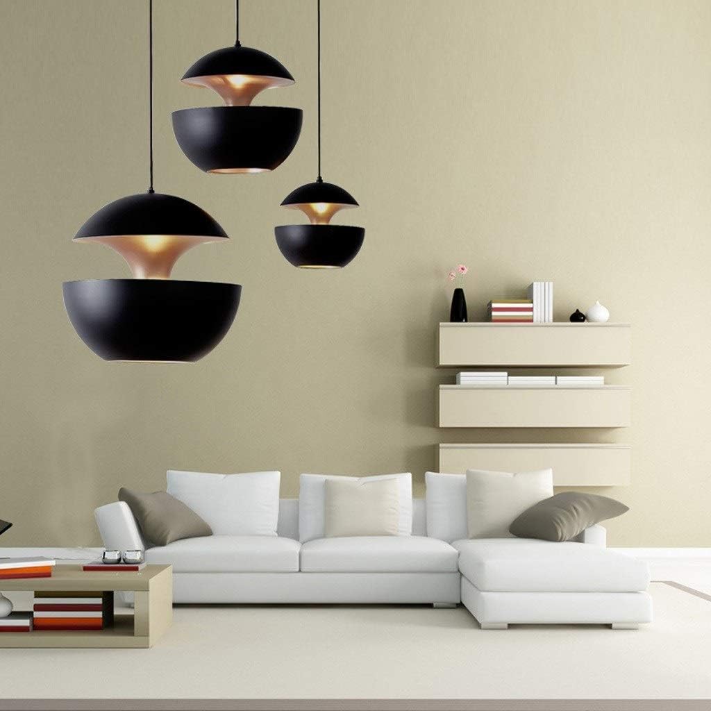 Black Fire Sphere pendant lights illuminating a modern living room with soft ambient warm lighting
