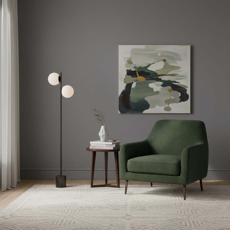 Floor lamp Two Spheres in a modern living room with a green armchair and an abstract painting.