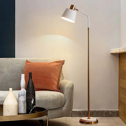 Floor lamp in a modern living room with a sofa and decorative vases