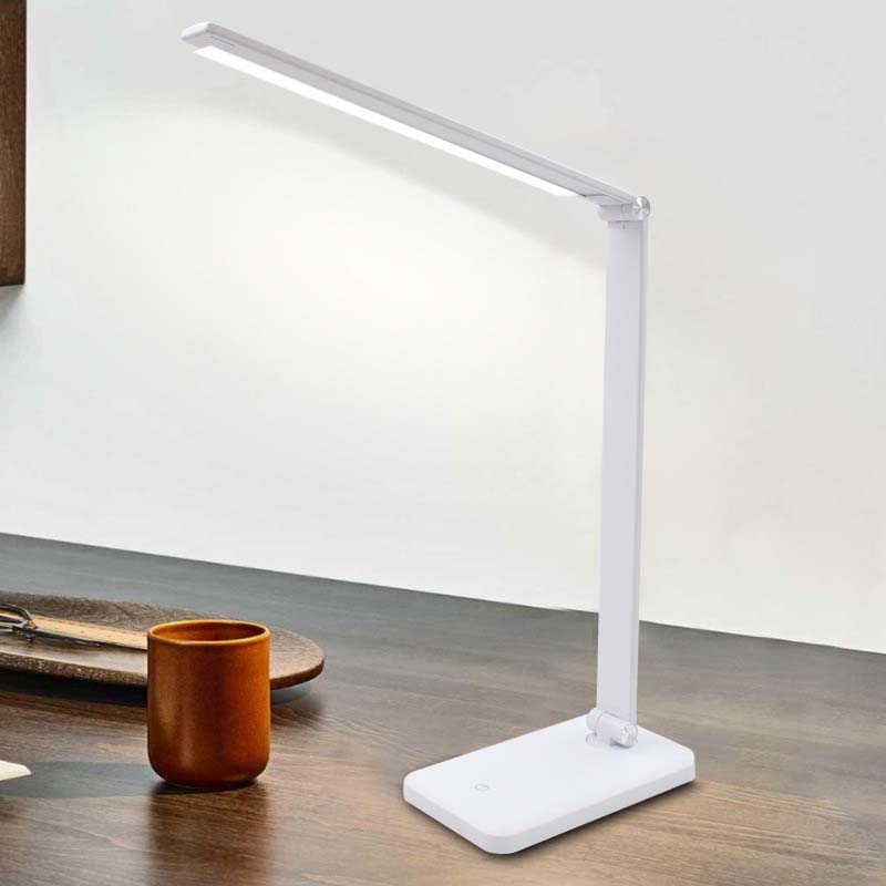 White LED desk lamp on a wooden surface with a minimal background