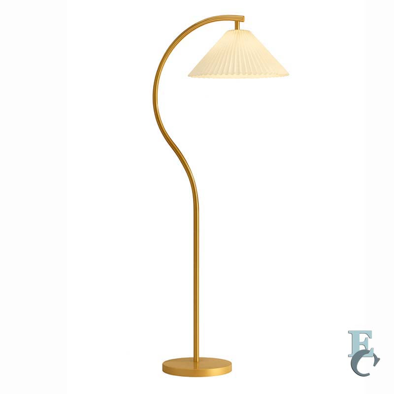 Gold floor lamp with a pleated shade on a white background