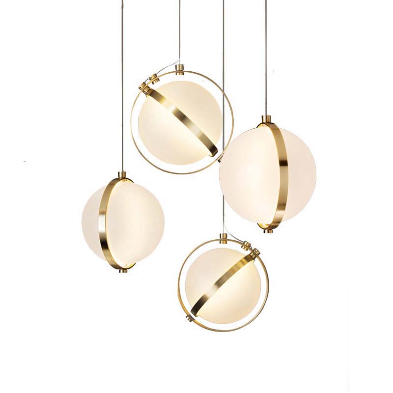 Golden Framed Globe Pendant with glass spheres and golden frames on white background.