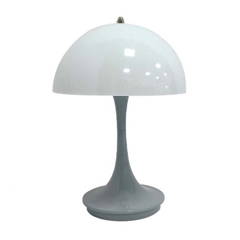 Table lamp with white dome shade and gray base on a white background