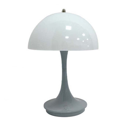 Table lamp with white dome shade and gray base on a white background