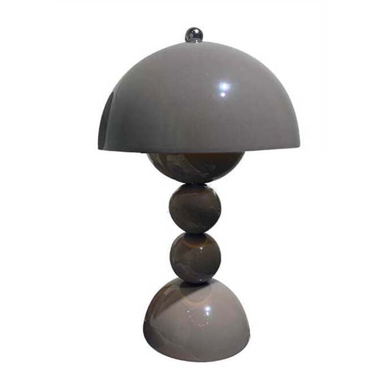 Table lamp with a gray dome shade and three spherical bases on a white background