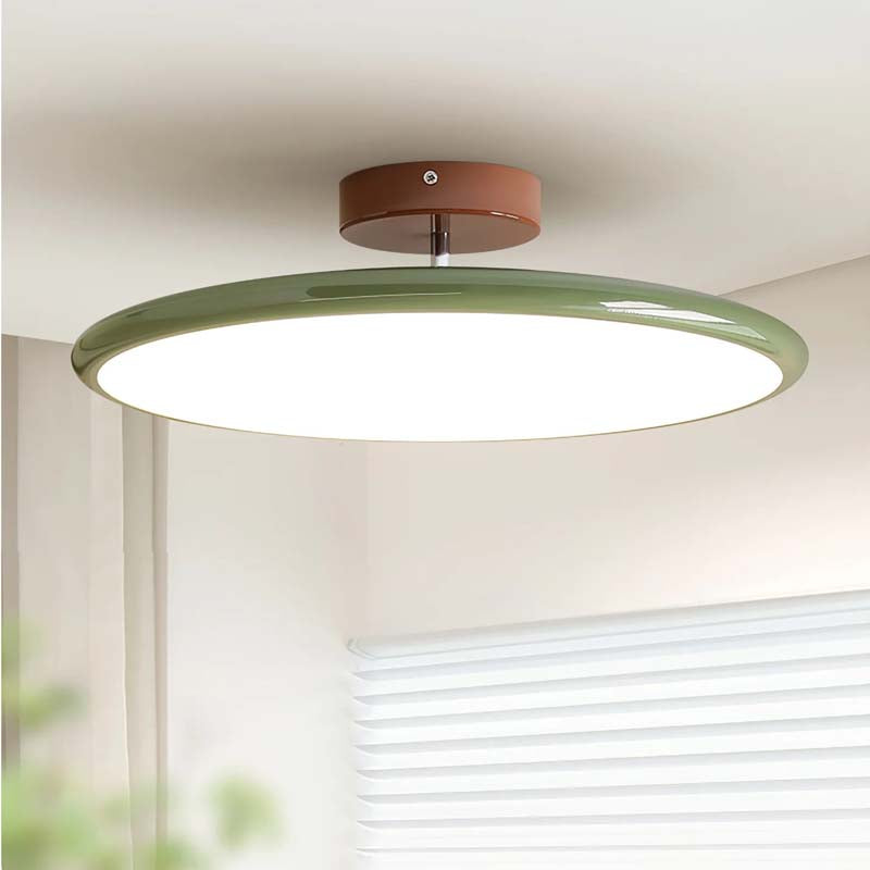 Ceiling light fixture with a green shade and brown base in a room with window blinds.