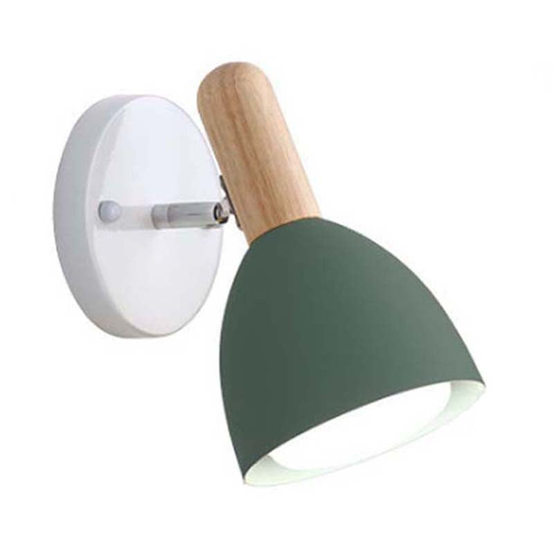 Wall-mounted lamp with green shade and wooden arm on a white 