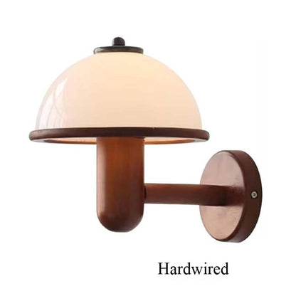 Wall-mounted lamp with wooden base and beige shade on a white background