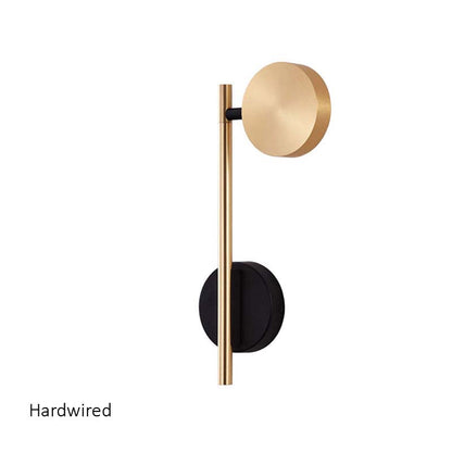 Modern wall light fixture with gold and black design on a white background
